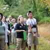 people conducting a citizen science investigation, bird watching with binoculars