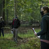 Amy Freestone teaching students in the forest 