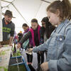 students looking at a science exhibit. 