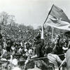 black and white photo of a large crowd from the original earth day in 1970.